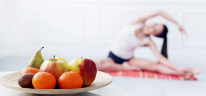 fruits against the background of a girl doing yoga